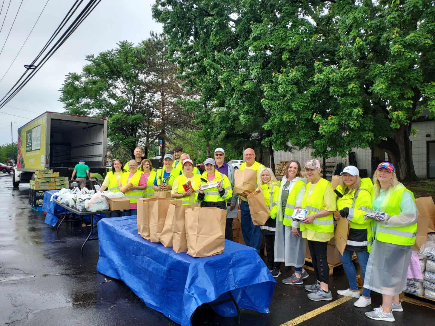UGI employees stand together at food distribution line.