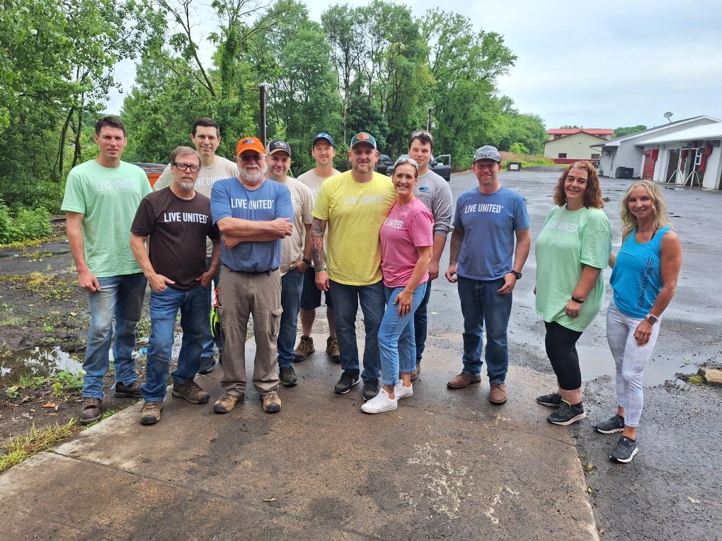 UGI employees stand together at Sleep In Heavenly Peace project.