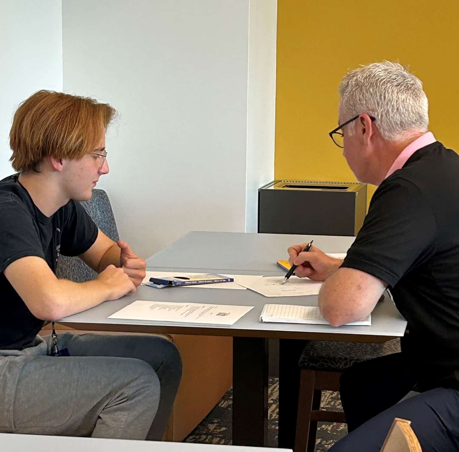 UGI volunteer mentors a student.