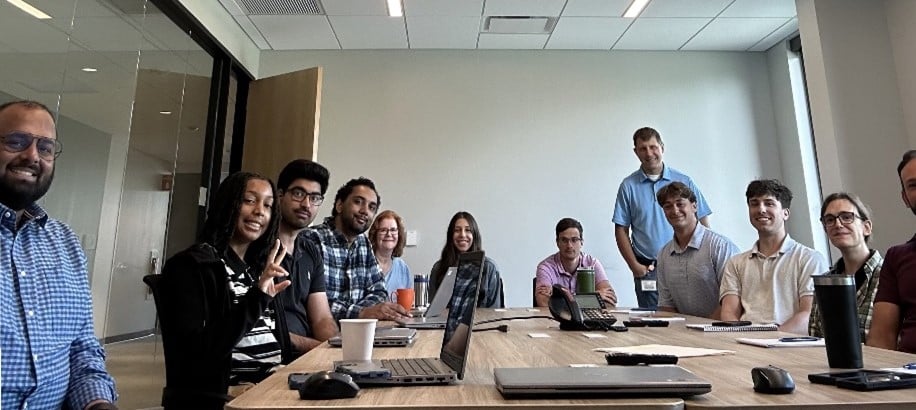 UGI employees smile for a photo during a meeting.