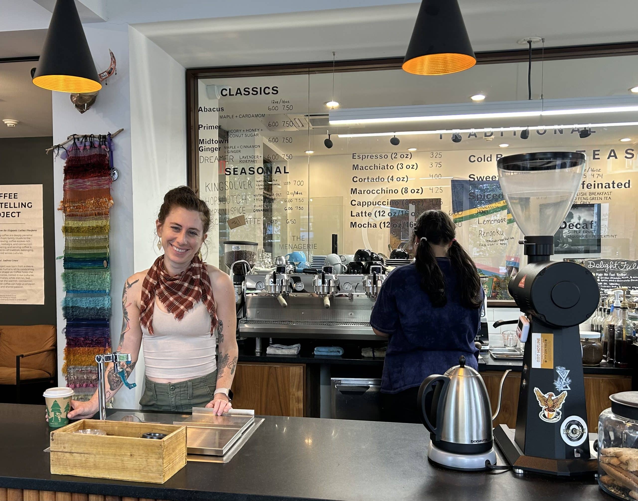 Andrea Grove standing behind the counter at Elementary Coffee Co.