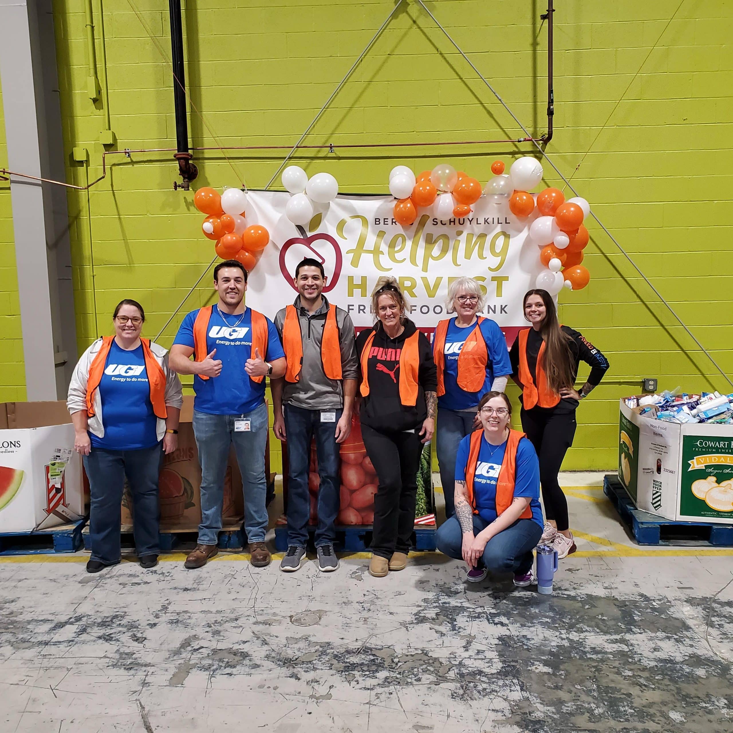 Employees volunteering at Helping Harvest.