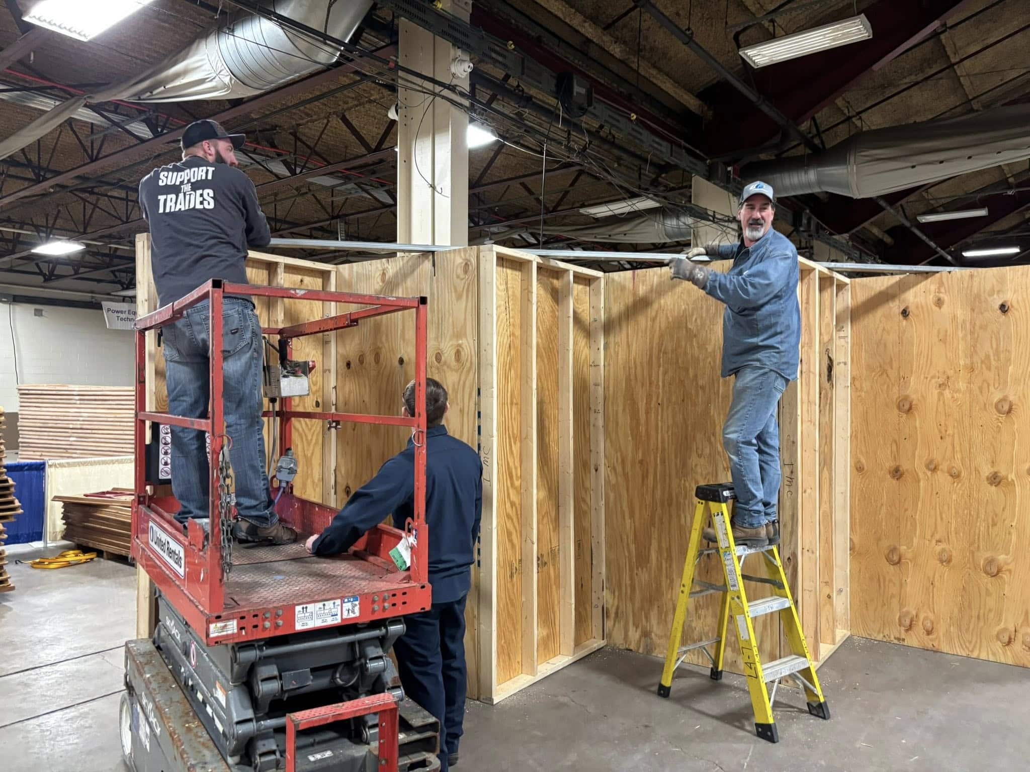 Nick, on far left, and Wayne, on far right, helping to set up for the SkillsUSA competition.